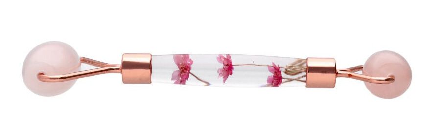 Masseur en quartz rose avec manche floral double rouleaux