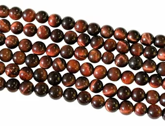 Oeil de taureau AA perles 6mm sur fil 40cm